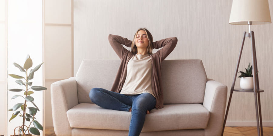 Woman relaxing in living room
